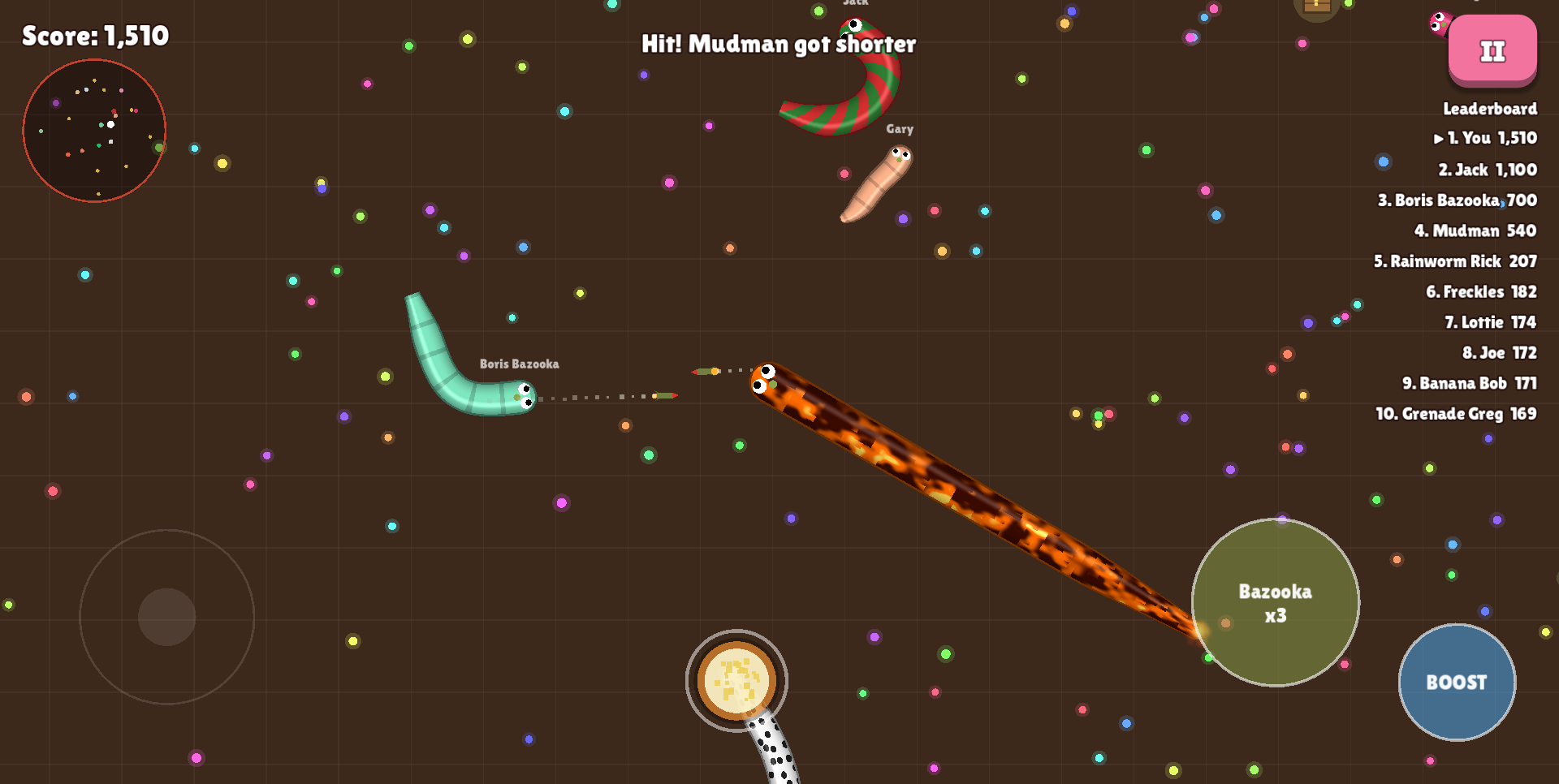 Gameplay: a long lava-skinned worm fires a bazooka while an explosion cuts a rival worm short